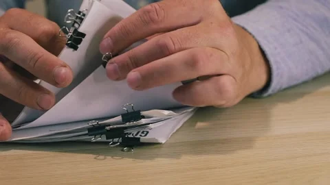 Office worker hands sorting paper documents Stock Footage 346568132