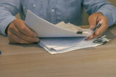 Office worker hands sorting paper documents Stock Photos