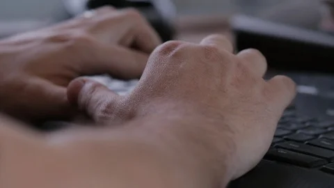 Office worker hands type on black keyboard Video stock 125643568