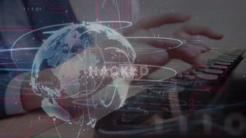 Office worker hands typing and starting globe, showing HACKED for security while Stock Footage 333704199