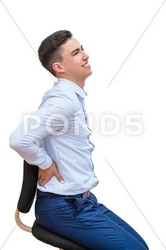 Office worker having lower back pain. Stock Photos