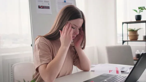 Office worker with headache touching her temples Stock Footage 171546115