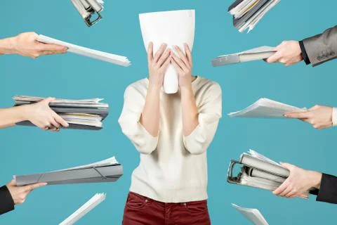 An office worker hid behind a document, Office worker overworked Stock Photos