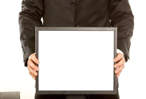 Office worker holding blank computer monitor Foto stock