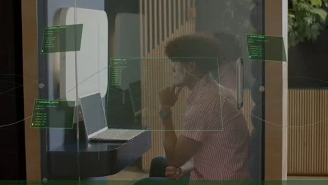 Office worker leaning, resting chin in glass pod, initiating HUD panels on glass Stock Footage 333594485
