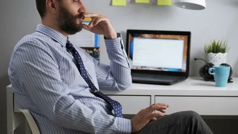 Office worker loafer. Bearded man in shirt and tie sitting at office at desk Stockbeeldmateriaal 130307783