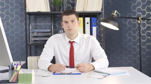 Office worker looking at camera. Video stock 220163608
