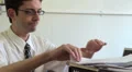 Office worker looking through papers HD Footage