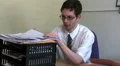 Office worker looking through paperwork HD Footage