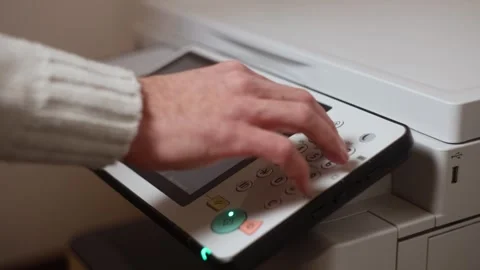 An office worker makes print settings for a printer on a touch screen Stock Footage 294628013