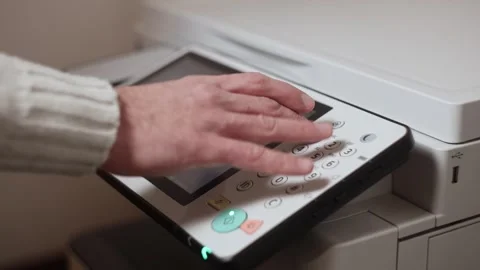 An office worker makes print settings for a printer on a touch screen Stock Footage 294628047