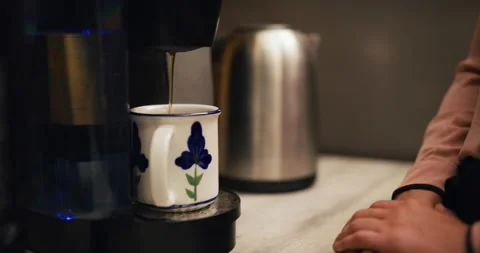 Office worker makes single serve coffee pod and drinks it in company kitchen. Cl Stock Footage 199459159