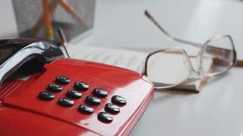Office Worker Man Dials The Phone And Writes On Notepad And Put The Glasses On T 스톡 동영상 107613161