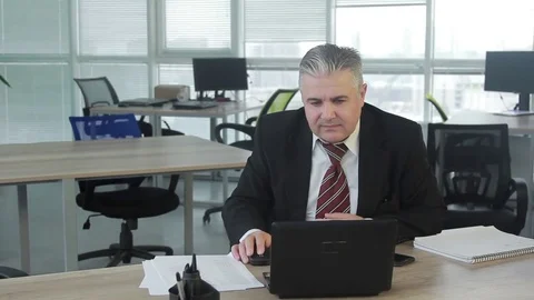 Office worker, manager gets good news and smiles and cheers happily Stock Footage 71028393