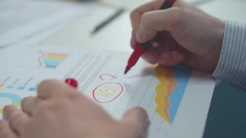 Office worker marks errors in the document 스톡 사진