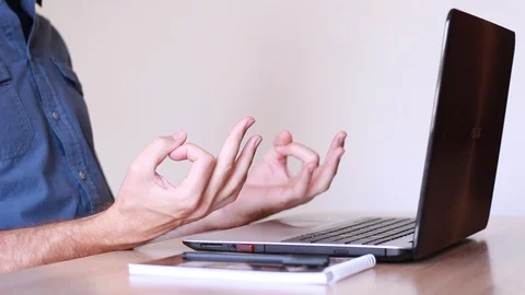 Office worker meditating at his work place Stock Footage 92609282