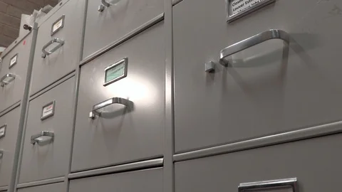 Office Worker Opening a File Cabinet in a File Storage Room. Stock Footage 106052897
