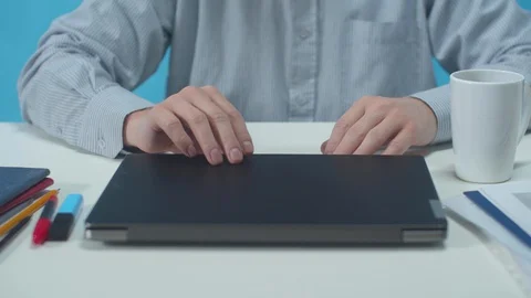 Office worker opens a laptop and works with documents Stock Footage 129966424