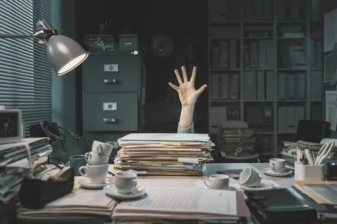 Office worker overwhelmed with paperwork Фото
