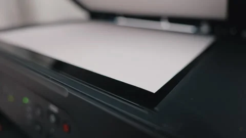 Office worker placing paper into scanner of multifunction printer 스톡 동영상 344063630