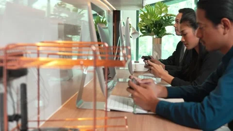 Office worker playing mobile games together in office during taking a break Stock Footage 171967086