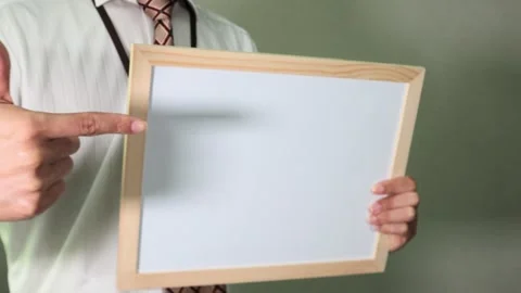 Office worker pointing to a whiteboard Stock Footage 336587646