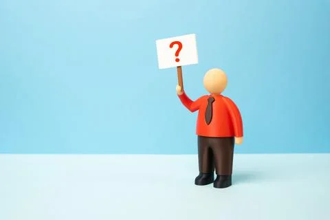 An office worker with a poster and a question mark. What to do next, which .. Stock Photos