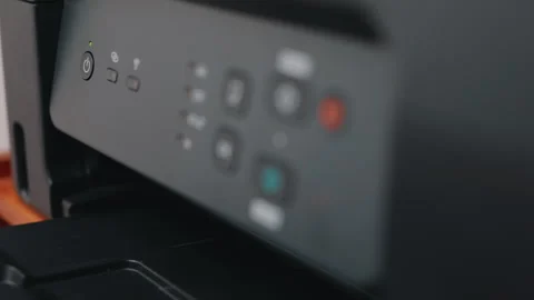 Office worker pressing power button on multifunction printer Vidéo 344063438
