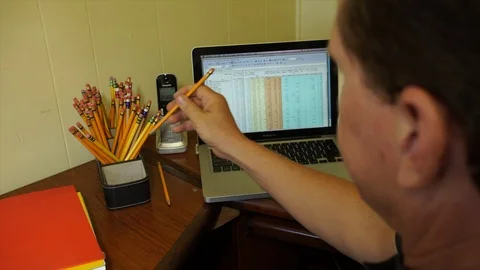 Office Worker Putting A Pencil Back In Pencil Holder Video stock 95930314