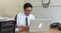Office worker reading computer screen HD Footage