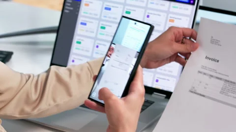 Office Worker Scans Documents Using Smartphone Stock Footage 337641421