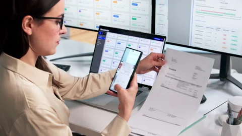 Office Worker Scans Documents Using Smartphone Stock Footage 338171160