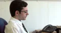 Office worker shouting on the phone HD Footage
