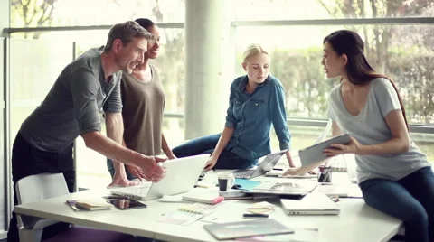 Office worker showing colleagues digital tablet Stock Footage 63289688