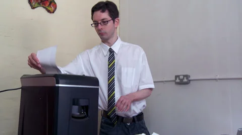 Office worker shredding paper Stock Footage 30398666