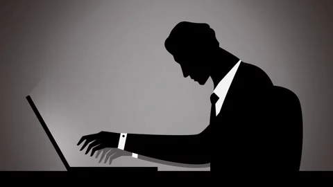 Office worker silhouette working at a computer Stock Footage 342377054