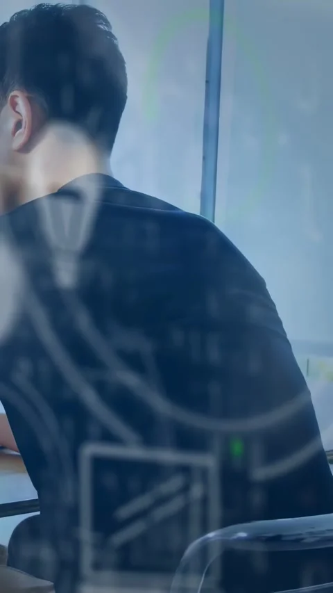 Office worker sitting at desk, responding to ping while faint icons scrolling 스톡 동영상 334598429