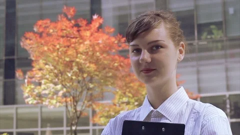 Office Worker Smiles at Camera Stock Footage 89634254