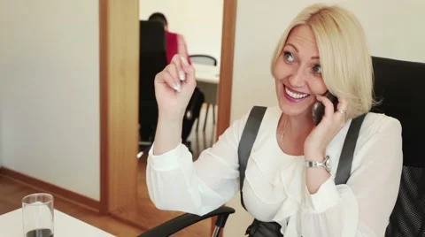 Office worker smiling talking using smartphone Stock Footage 64288280