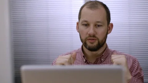 An office worker solves a problem at work at his computer Stock-Footage 73124026