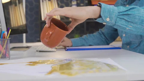 Office worker spills coffee on documents. Stock Footage 218866962