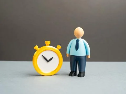 An office worker with a stopwatch. Concept of work schedules and standardized Stock Photos