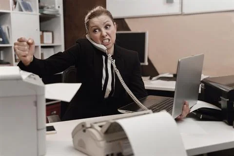 Office worker stressed. Overworked concept. Angry furious office woman Stock Photos