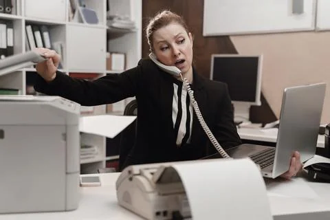 Office worker stressed. Overworked concept. Angry furious woman. Stock Photos