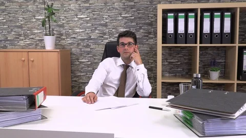Office worker suffers a headache Stock Footage 115787662