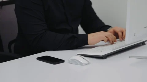 Office worker takes a call and speaks hands-free on own smartphone Stock Footage 106498475