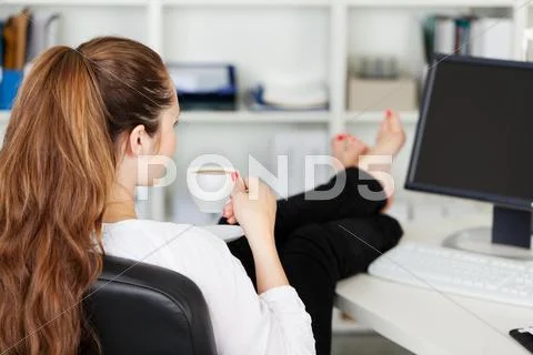 Office worker taking a coffee break Stock Photos