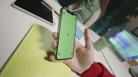 Office worker taps screen of smartphone to activate mechanism Stock Footage 303067642