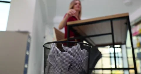 Office worker throws crumpled paper balls into trash can Stock Footage 271332826