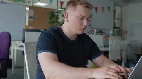 Office worker tries to stretch his neck after sharp pain. Stock Footage 112601401